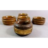 A wooden napkin ring made from Teak of HMS Duke 1916 and four other wooden napkin rings