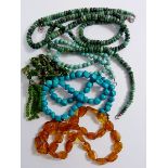 An amber necklace, two turquoise necklaces, green stone necklace etc. some with silver clasps