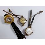 A 9 carat gold ladies watch, a 9 carat gold backed watch and an early 20th century 18 carat gold fob