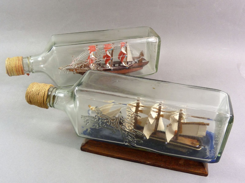 Two vintage model ships in bottles