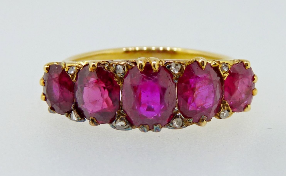 A Victorian gold ring set five graduated rubies interspersed with chip diamonds, size M, 5gm,