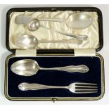 A silver christening spoon and fork cased, Chester, 1921 by Barker Brothers, a silver teaspoon,