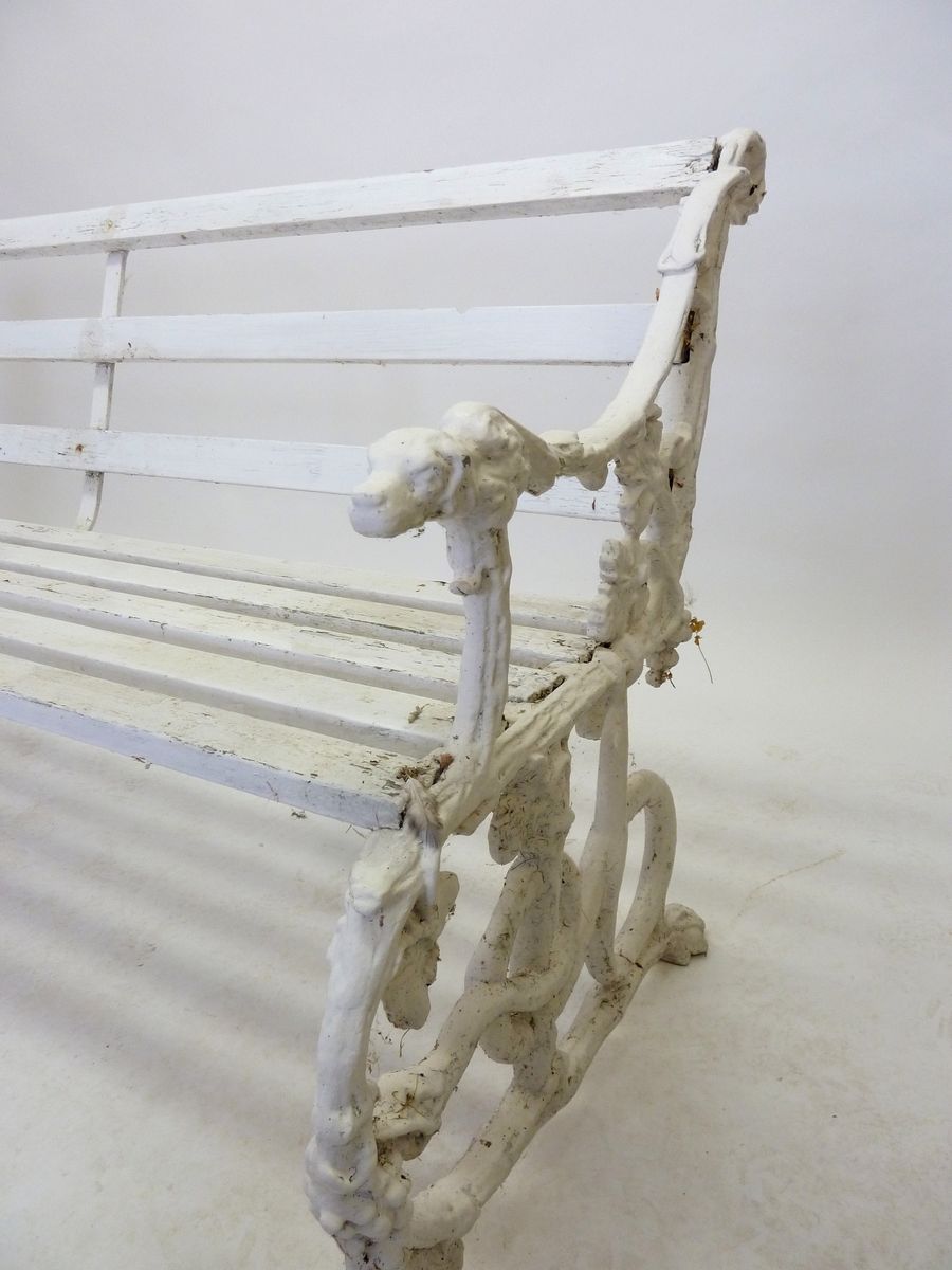 A Victorian Coalbrookdale style garden bench with dogs head arm rests and scrolling vines, 146cm - Image 2 of 2