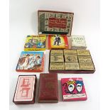 A box of old playing cards and a funny match jokes set
