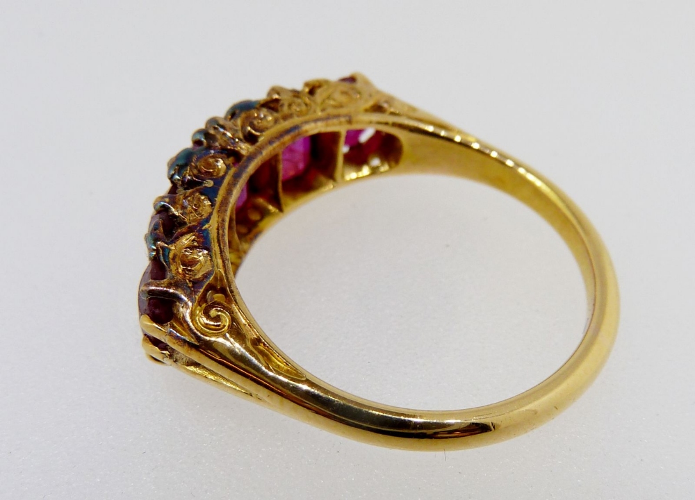 A Victorian gold ring set five graduated rubies interspersed with chip diamonds, size M, 5gm, - Image 3 of 4