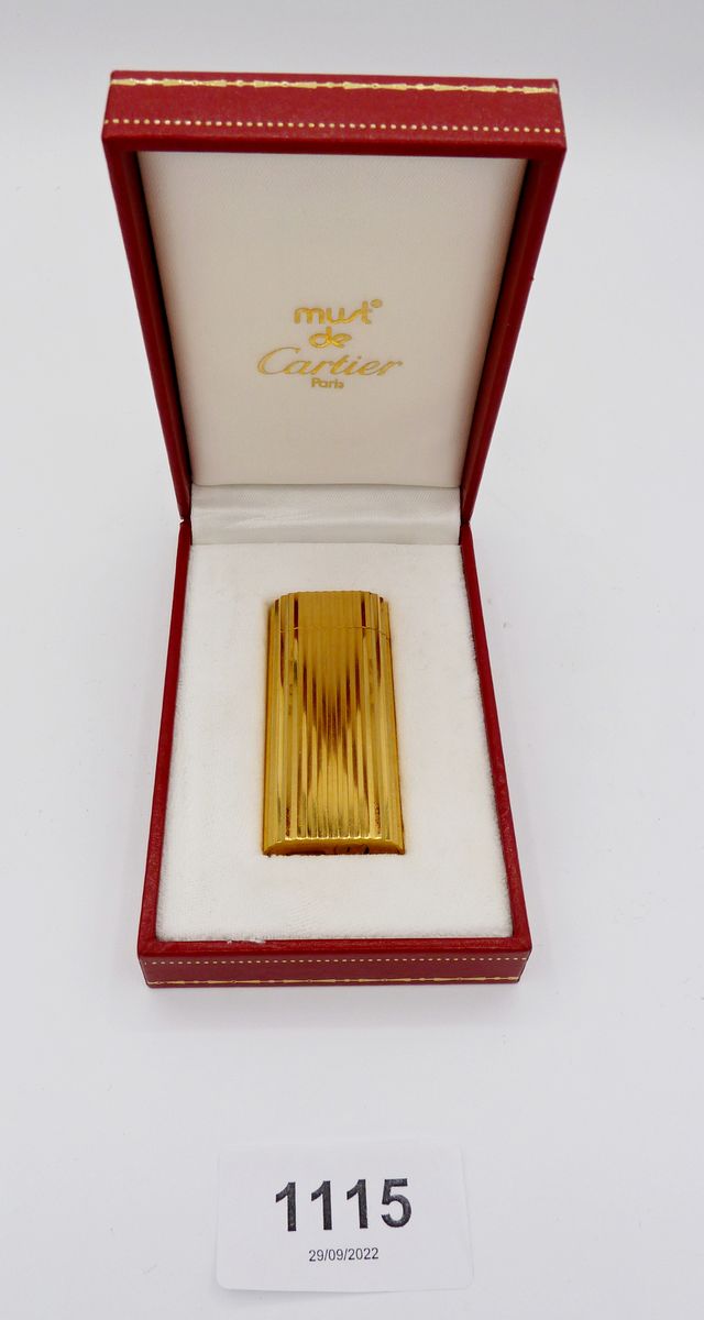 A gold plated Cartier cigarette lighter, boxed