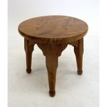 A light oak circular stool, 32cm tall