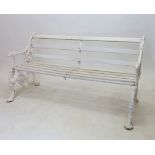 A Victorian Coalbrookdale style garden bench with dogs head arm rests and scrolling vines, 146cm