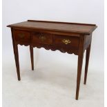 A cherry wood side table with three frieze drawers, 89cm wide