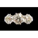 A fine 18 carat white gold three stone diamond ring, total diamond weight approx. 3 carats, size O