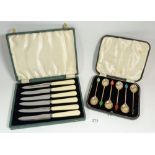 A set of six silver harlequin coffee bean spoons and a set of tea knives, both boxed