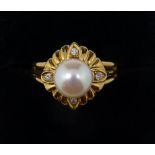 An 18 carat gold ring set pearl with gadrooned surround set four diamonds, size L, 4.3g