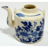 An 18th century salt glaze miniature chinoiserie water dropper in the form of a teapot