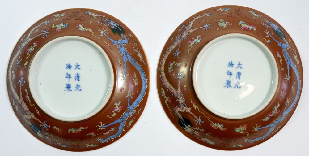A pair of Chinese Kang Xi saucers paitned Babao and Shou symbols with 'Da Qing Guang Xu Nian Zhi - Image 2 of 9