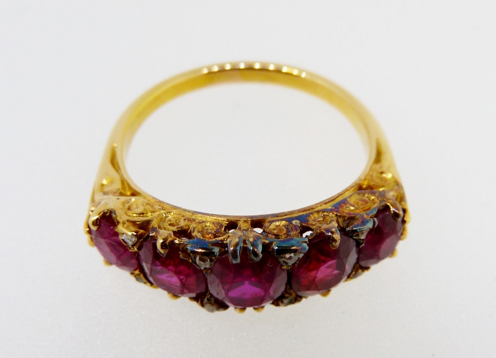 A Victorian gold ring set five graduated rubies interspersed with chip diamonds, size M, 5gm, - Image 2 of 4
