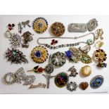 A box of various costume brooches and a costume necklace