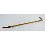 A bamboo riding crop with horn handle and silver plated collar