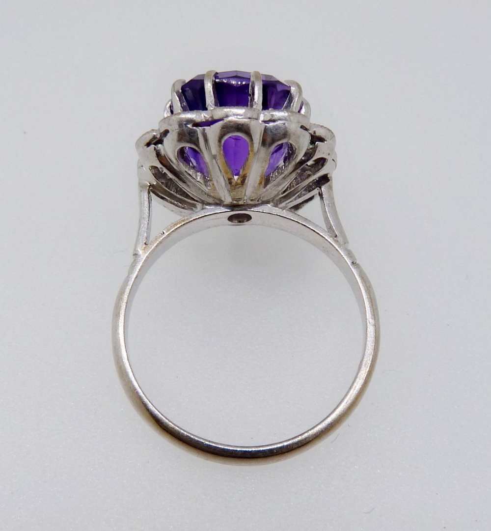 An 18 carat gold ring set cushion cut amethyst within diamond surround, size K-L, 6.4g - Image 4 of 4