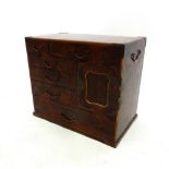 A Japanese lacquer and marquetry table top cabinet with arrangement of drawers and pigeon holes,