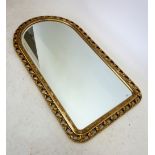 A gilt arch topped mirror, 86 x 48 cm