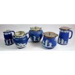 A Wedgwood group of early 20th century Jasperware comprising two biscuit barrels, two water jugs and