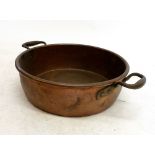 A copper preserving pan with two handles