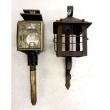 A cast iron wall lantern and a carriage lamp
