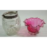 A Victorian cranberry glass frilled bowl and a cut glass and silver plated biscuit barrell