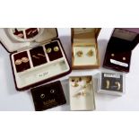 A box of assorted yellow metal and gold earrings