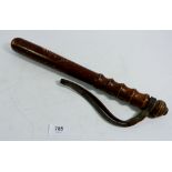 An old police truncheon with leather handle