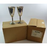 A set of twelve silver plated wine goblets boxed