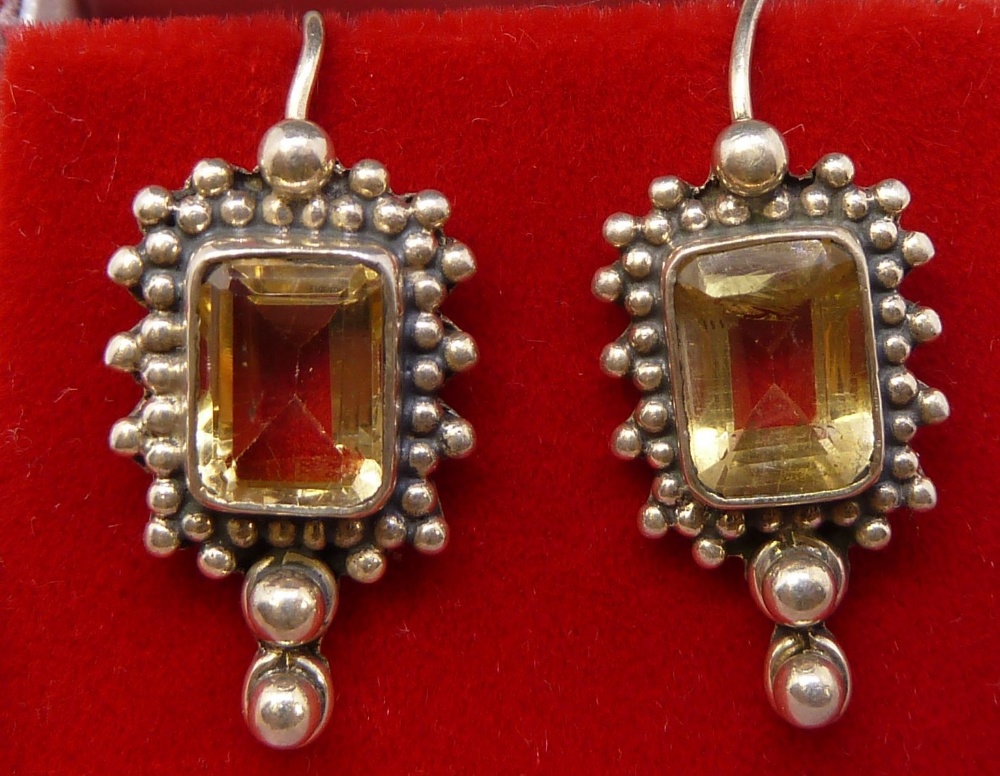 A pair of silver and citrine pendant earrings