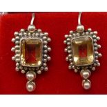A pair of silver and citrine pendant earrings