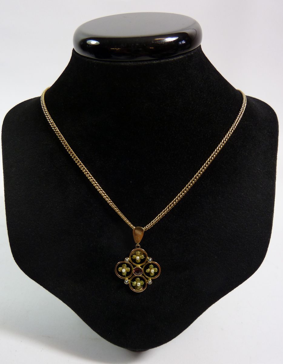 An Edwardian yellow metal pendant set pink stone and pearls on a 9 carat gold chain (chain approx.