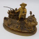 A 19th century gilt bronze inkwell in the form of a child fishing, 13.5 cm wide