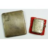 A silver cigarette case and a silver plated lighter