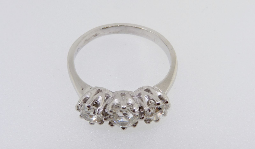 A platinum three stone diamond ring, size P to O, total diamond weight 1.32 carats - Image 5 of 5