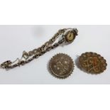 Two silver Victorian brooches (one with yellow metal inlay) and a silver and marcasite cocktail