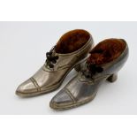A pair of Victorian shoe form novelty pin cushions