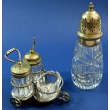 A silver plated and cut glass cruet set on trolley stand and a sugar castor