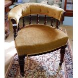 A 19th century mahogany framed tub chair with spindle back and turned supports