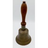 A Victorian brass school bell, 24 cm tall