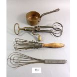 A miniature Victorian copper saucepan, two kitchen whisks and a hand whisk