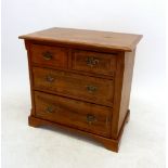 A small walnut chest of two short and two long drawers with rosewood crossbanding, 72 x 67 x 44cm