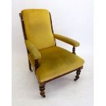 A Victorian armchair on turned supports