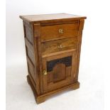 An oak bedside table with two drawers over cupboard, 51 x 79cm