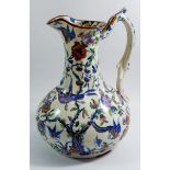 A Victorian toiletry jug with exotic bird decoration and intertwined handle, 32cm