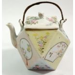 A Japanese faceted teapot painted reserves of birds, flowers and landscapes with bamboo handle