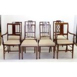 A set of six Edwardian mahogany lattice back dining chairs and a pair of Edwardian mahogany carver