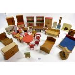 A quantity of vintage dolls house furniture